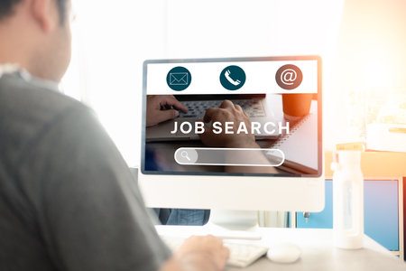 Job search concept, find your career. Man looking at online website by computer. People Searching for vacancies or position on the internet, recruiting, finding jobs. Unemployed And poor economy.の写真素材