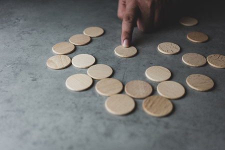 Male hand choice circles one wood block from many wood blocks The best choice concept.の写真素材