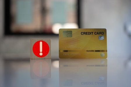 A credit card with icons of notification on wood block. Late payment, Business concept of payment...