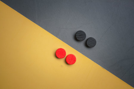 Circle wood blocks two colors opposite each other and two backgrounds with empty spaceの写真素材