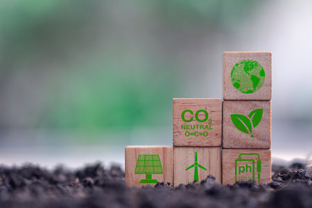 Green business and sustainable development. Wooden cubes with clean energy icon on soin. Save of earth, saving the environment, net zero emissions concept. Long term strategy of eco friendlyの写真素材