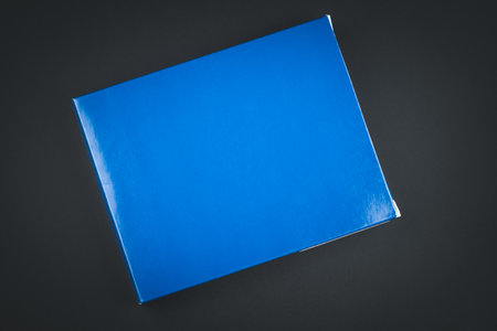 Simple blue paper box on a black background. Top viewの写真素材