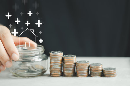 Arrow up and home icon with step stack of coin like a graph. Concepts of home interest, real estate,...