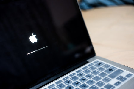 Bangkok, Thailand - October 12, 2023: iOS firmware update process on the screen at the Apple...
