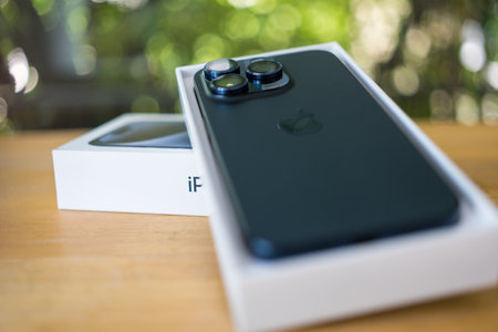 Bangkok, Thailand - October 15, 2023 : IPhone 15 PRO in box with iOS 17 features, tilt-shift lens....