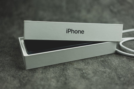 Bangkok, Thailand - October 15, 2023 : Unpacking the newest iPhone 15 pro blue titanium. Close up