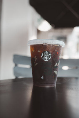 Bangkok, Thailand - October 16, 2023 : A cup of reusable cup cold Americano 25th Anniversary,...