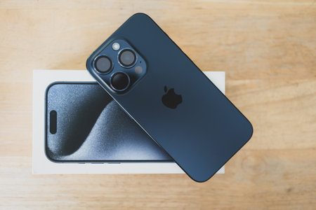 Bangkok, Thailand - October 23, 2023 : Back view of new iPhone 15 Pro Titanium Blue, lies face down...