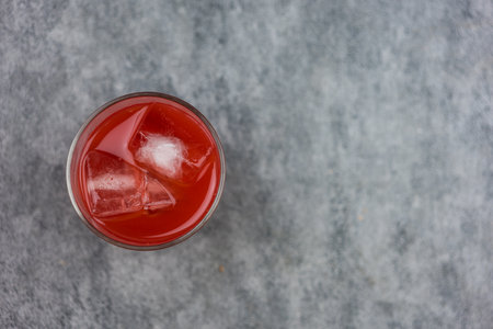Fresh cold pressed watermelon juice with ice for health. Top view