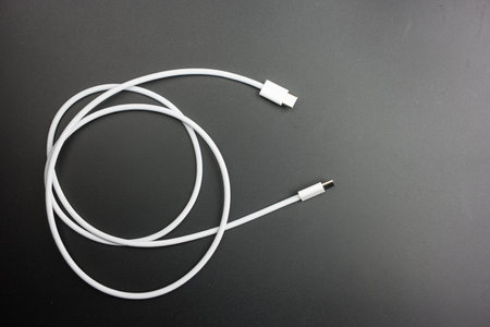 Bangkok, Thailand - October 27, 2023: New USB Type-C interface of IPhone for charge and high speed data communication. New cable standard for Apple's devices include with iPhone 15のeditorial素材