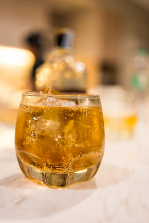 Selective focus whiskey glass on the marble table