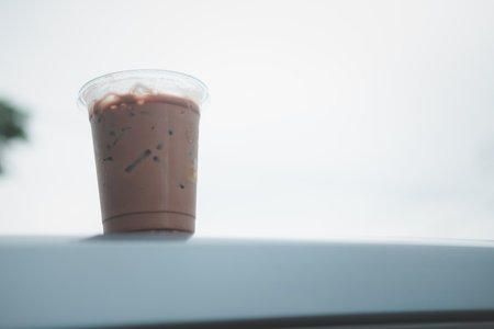 Iced Mocha coffee in a plastic take away cup in the morning with copy space.の写真素材