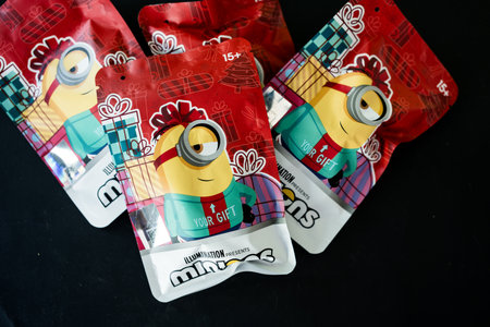 Bangkok, Thailand - November 11, 2023 : Wrapping package cute a Minions Q-TOPPING Christmas Version, The surprise unboxing from Miniso Thailandのeditorial素材
