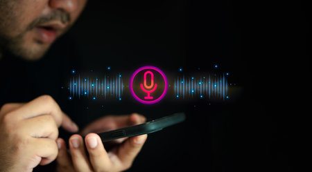 Man using virtual assistant app on mobile phone enhancing productivity with cutting edge technology use voice to direct, utilizes his smartphone as an AI assistantの写真素材