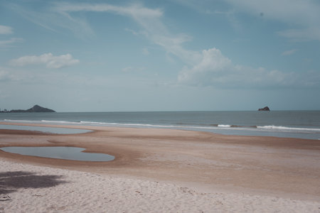 The beautiful beach in Khao Tao Beach, Hua Hin, Thailand. Cloud sky over beachの写真素材