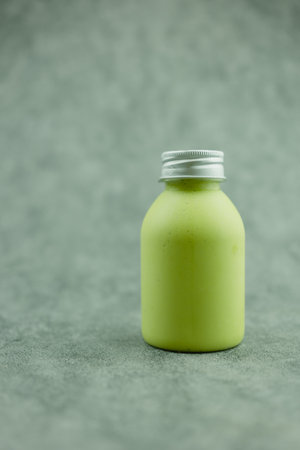 Avocado mix milk and honey smoothies in bottle. Close upの写真素材
