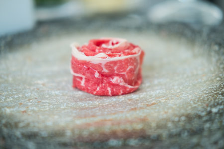 Premium rare slices of beef looks like flowers in the restaurant look appetizing served for Sukiyaki...