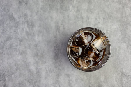 Top view of americano coffee glass shown ice and black coffee. Close upの写真素材