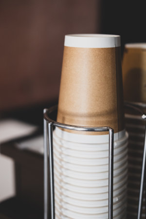 The stack of new take away stack of disposable brown coffee cupの写真素材