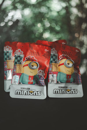 Bangkok, Thailand - December 1, 2023 : Wrapping package cute a Minions Q-TOPPING Christmas Version, The surprise unboxing from Miniso Thailandのeditorial素材