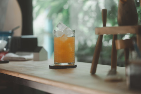 Orange juice in glass with ice, summer time concept. Freshly squeezed orangeの写真素材