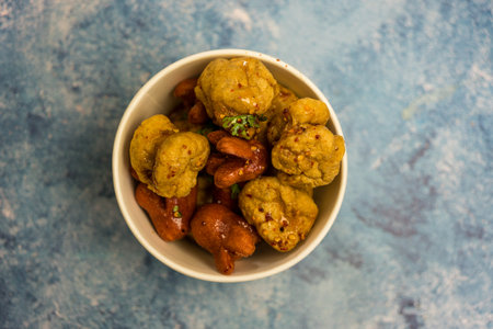 Fried meatballs and hotdog with spicy dipping sauce in a white bowl. Thai street food styleの写真素材