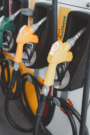 Bangkok, Thailand - December 7, 2023 : Shell gas pump nozzles in a service station, Close up fuel nozzles at Shell gas station, Panel and Dashboard of fuel nozzles of Gasohol and Diesel.のeditorial素材