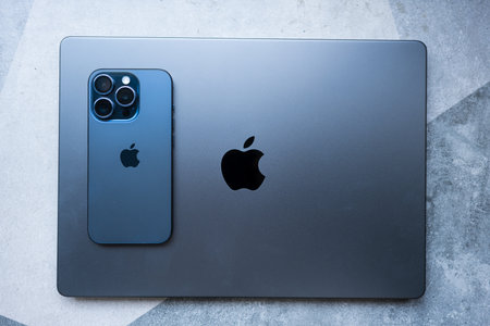 Bangkok, Thailand - December 5, 2023 : New iPhone 15 pro blue titanium and Apple MacBook Pro M3 Max space black. New products from Apple in 2023のeditorial素材