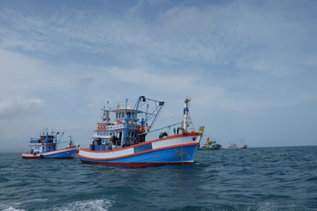 Thai fishing boat sailing on the sea with beautiful clear sky on Koh Samaesarn. Sattahip, Chonburi, Thailandの写真素材