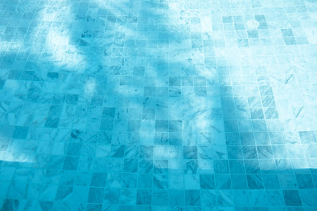 Swimming pool. Underwater view, blue tiles and blue water. Beautiful Outdoor poolの写真素材