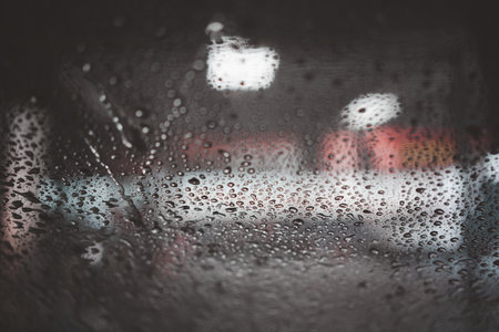 A close up of the windshield car at the moment of a car wash using pressure washerの写真素材