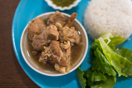 Stewed pork ribs served with rice and vegetableの写真素材