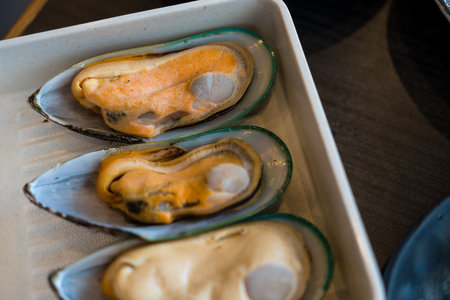 New Zealand mussel on white plate, buffet menu prepared for yakinikuの写真素材