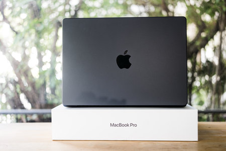 Bangkok, Thailand - December 15, 2023 : The new MacBook Pro with M3 Max processor Space Black colour on a wooden table. Apple launched a new MacBook Pro in 2023のeditorial素材