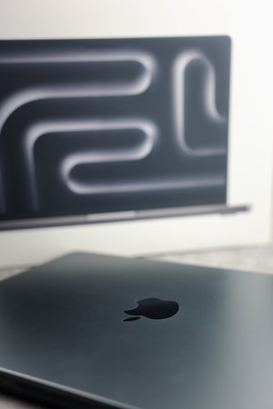 Bangkok, Thailand - December 15, 2023: A new modern design of space black colour of Apple MacBook Pro M3 Max 14 Inch screen. Close up a brand logo name.のeditorial素材