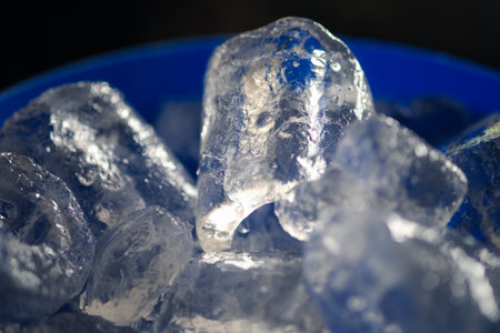 Ice cubes in blue bucket. Close upの写真素材