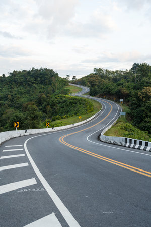 Beautiful curved road look like number 3 on the high mountain in Nan province, Thailand. An iconic tourist attraction place on the way to Bo Kluea district, Nan, Thailand.の写真素材