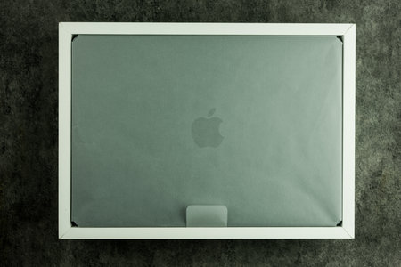 Bangkok, Thailand - December 16, 2023 : The new MacBook Pro with M3 Max in packaging on the white box, a new processor M3, Space black color is a professional laptopのeditorial素材