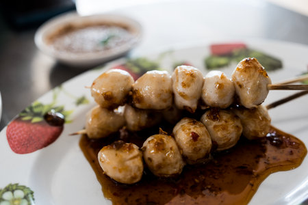Grilled pork balls on skewers with sweet chili sauce. Snack foods.の写真素材