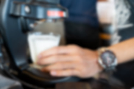 Blur background of a barista making dirty coffee.の写真素材