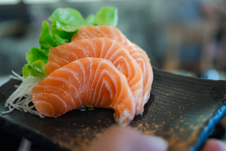 Fresh salmon sashimi. A famous Japanese menu is salmon sashimi. Many omega 3 dish.の写真素材