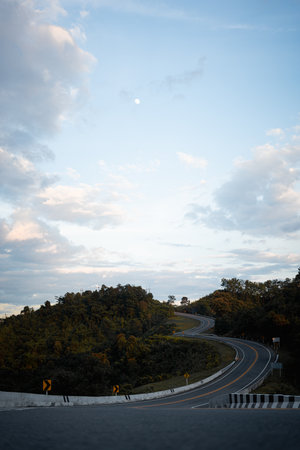Beautiful curved road known as number 3 road on the high mountain along the way to Bo Kluea district in Nan province, Thailand, An iconic tourist attractionの写真素材