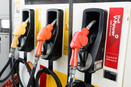 Bangkok Thailand, 24 December 2023 : Shell gas pump nozzles in a service station, Close up fuel nozzles at Shell gas station, Panel and Dashboard of fuel nozzles of Gasohol and Diesel.のeditorial素材