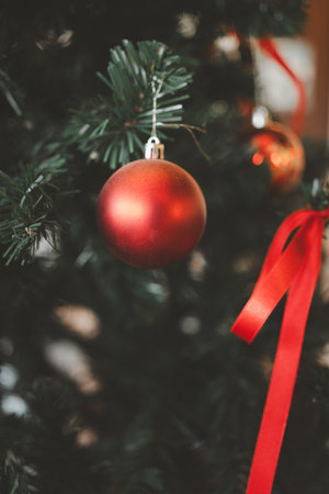 Bright red balls hanging on Christmas tree. Christmas ornaments and New Year decor.の写真素材