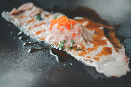 Grilled sushi wagyu beef with shoyu sauce on top with ebiko shrimp eggs. Premium grilled beef sushiの写真素材
