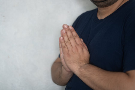 Asian man raise hands to pay respect or sawasdee. Lifestyle thai people conceptの写真素材