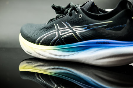 Bangkok, Thailand - January 9, 2024 : Asics shoes, ASICS Running Shoes Gel Nimbus 25 WIDE. Creative shot of Asics sport sneakers for jogging. ASICS is a Japanese athletic equipment companyのeditorial素材