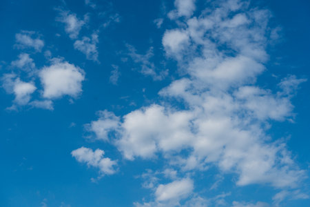 Summer blue sky cloud light blue background. Beauty bright cloud cover in the sun calm clear.の写真素材