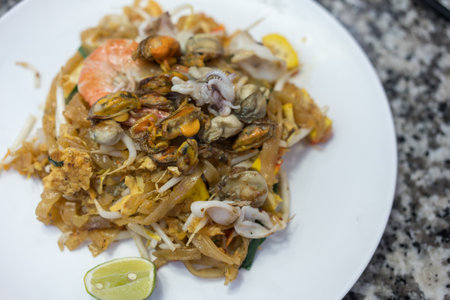 Delicious seafood Pad Thai with lemon. Top viewの写真素材