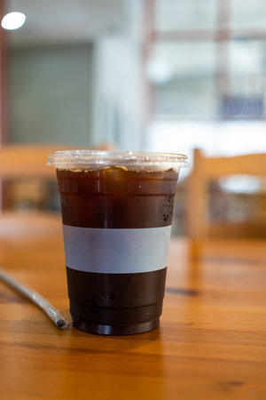 Cold black coffee on the table in the coffee shop. Close upの写真素材
